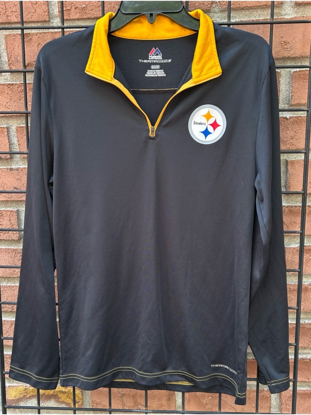 Majestic Black and Gold Half-Zip Pullover with Chest Patch